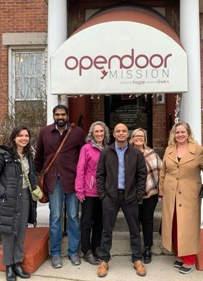 Unity Renewables and project partners outside Open Door Mission in Rochester, NY, site of a DOE-supported solar-plus-battery storage project