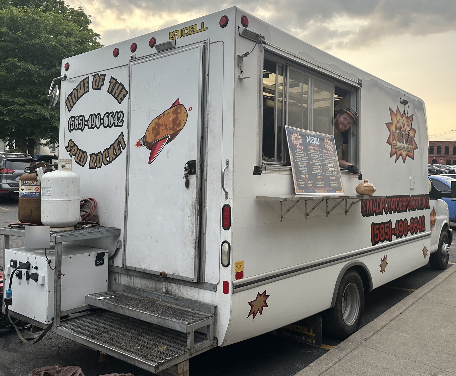 Mad Potatoes food truck from Nashville, Tennessee, showing its serving window, branded side panel, and rear-mounted PowerBox